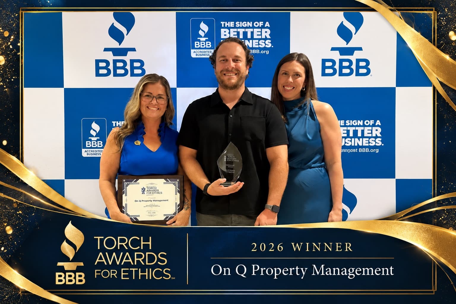Three On Q Property Management team members holding the BBB Torch Awards for Ethics plaque and trophy in front of a BBB backdrop, under a 2026 Winner banner
